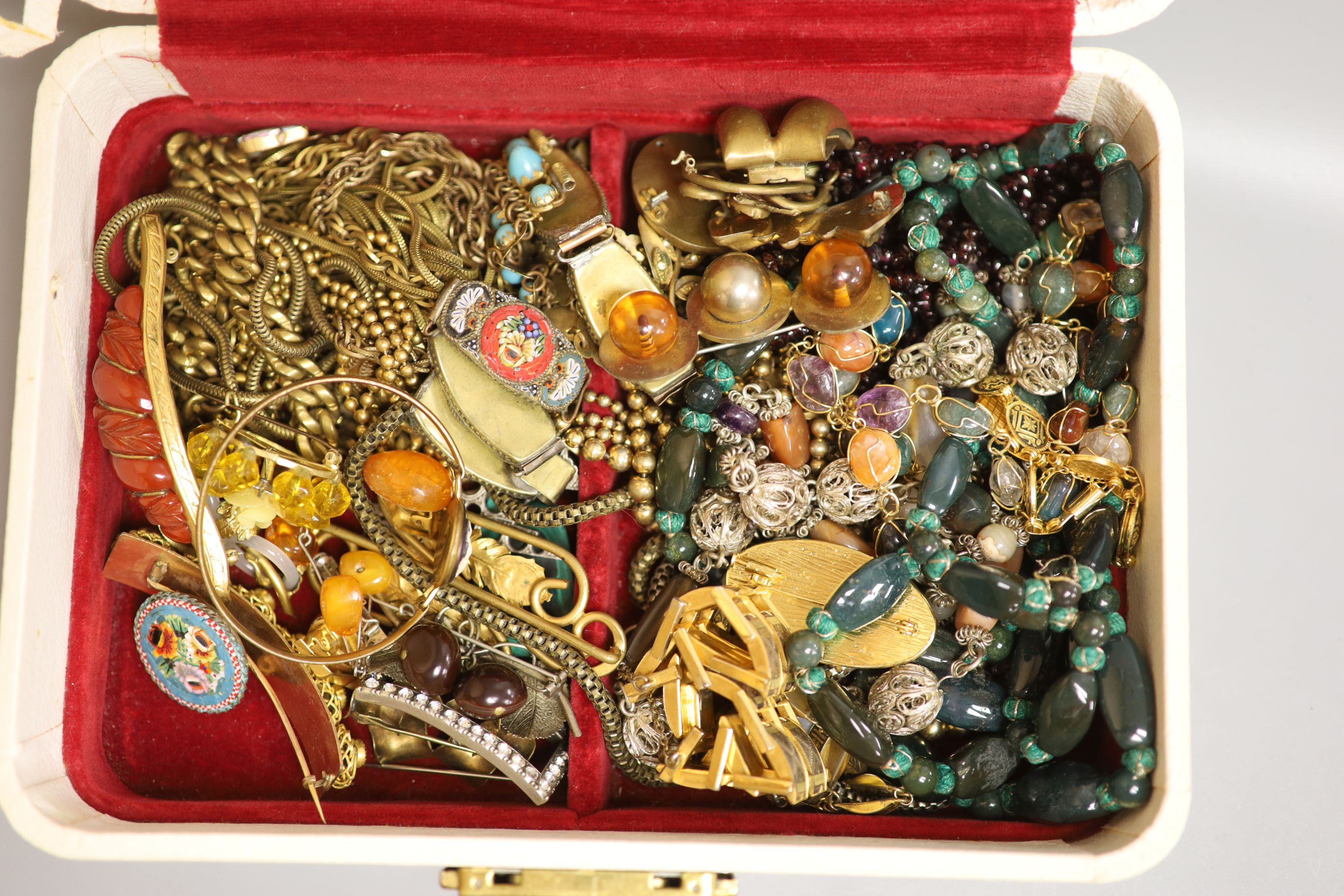 A group of assorted costume jewellery including gilt metal and hardstone necklace.